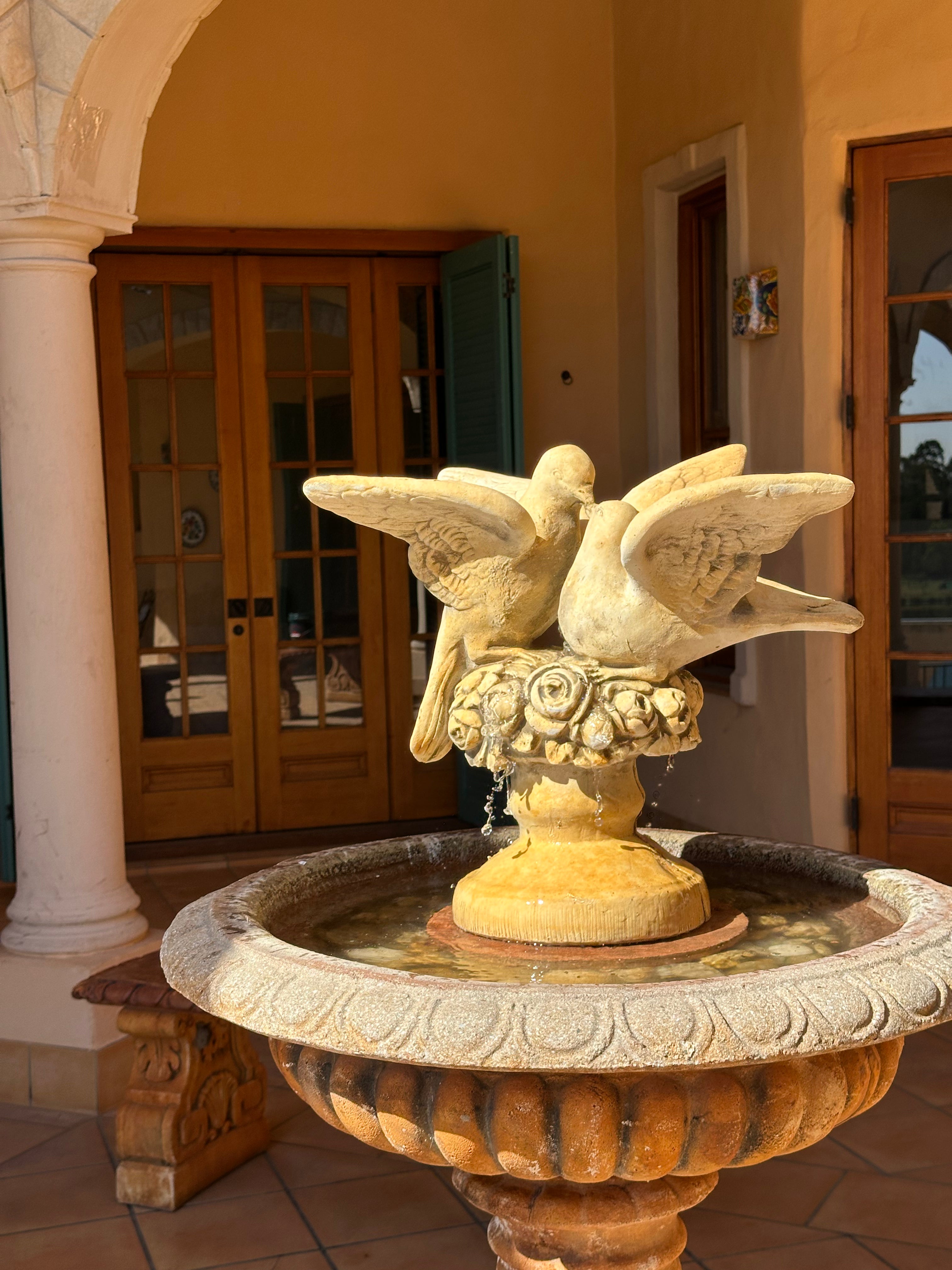 Doves Concrete Limestone Cement Statue on a concrete water feature in backyard setting
