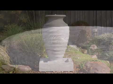 Load video: Onde Sandstone Look Urn Water Fountain with Base Reservoir in Outdoors
