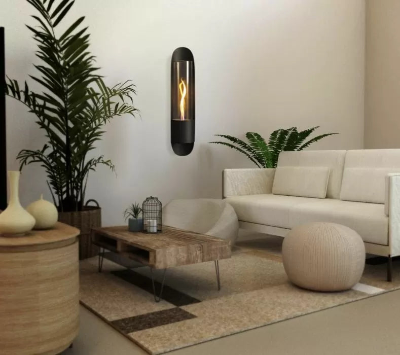 Modern living fireplace in a room with a white sofa, wooden coffee table, and decorative plants.