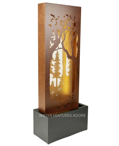 Decorative water feature with tree silhouette design on a white background