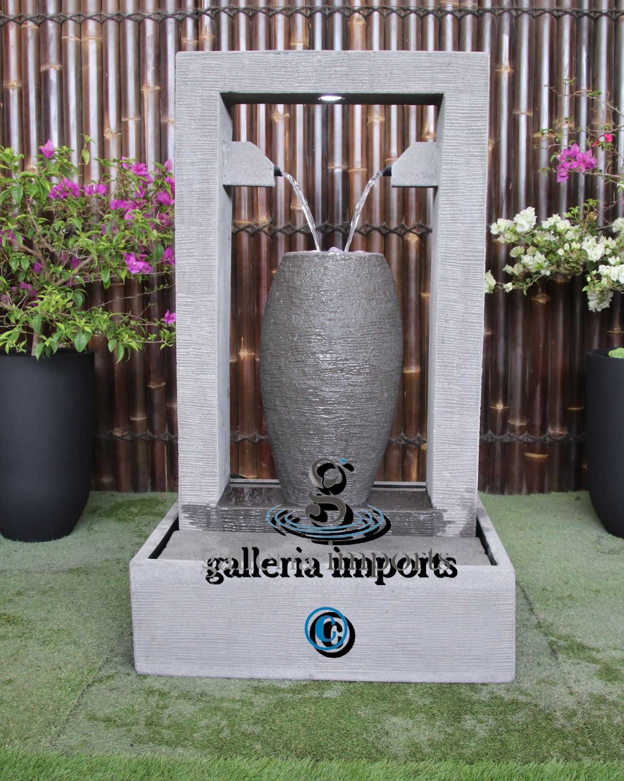 Decorative outdoor water fountain surrounded by plants.