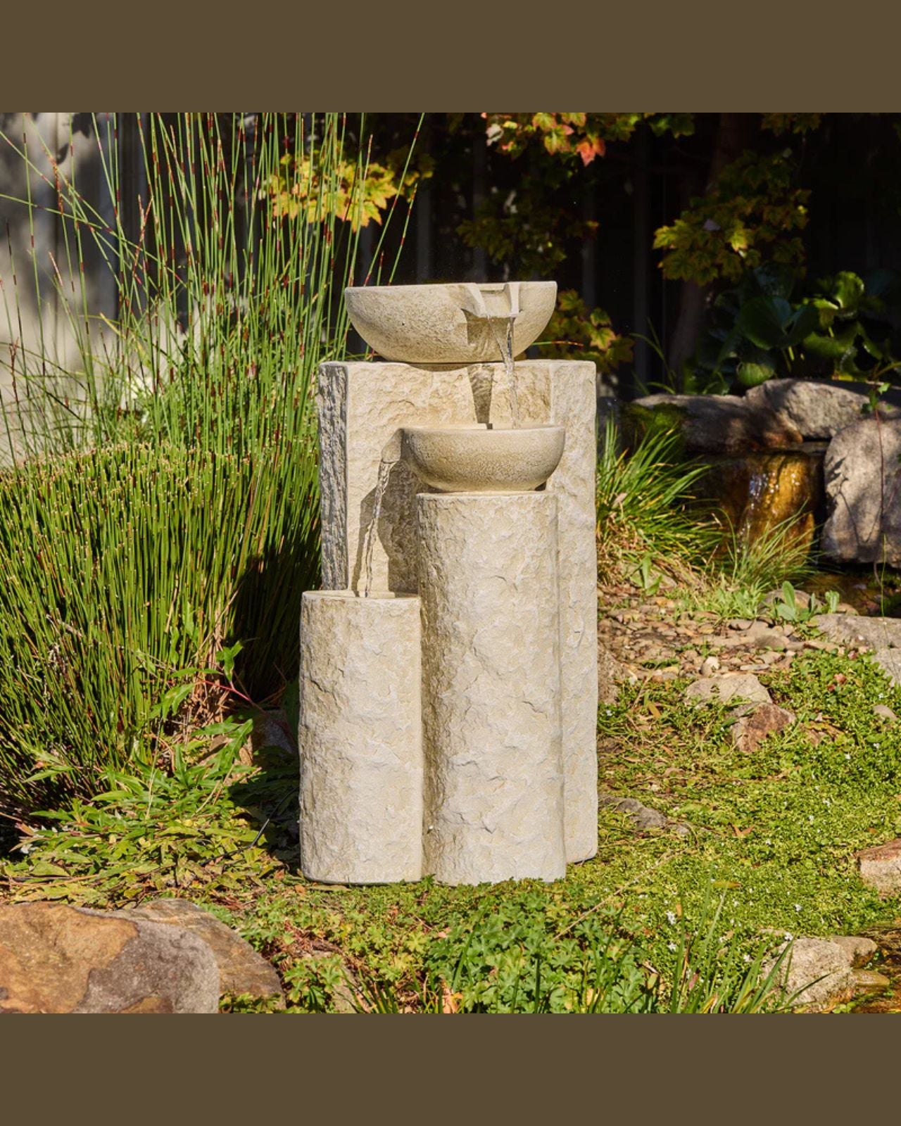 Echo Falls Stone garden fountain with three bowls in a natural setting