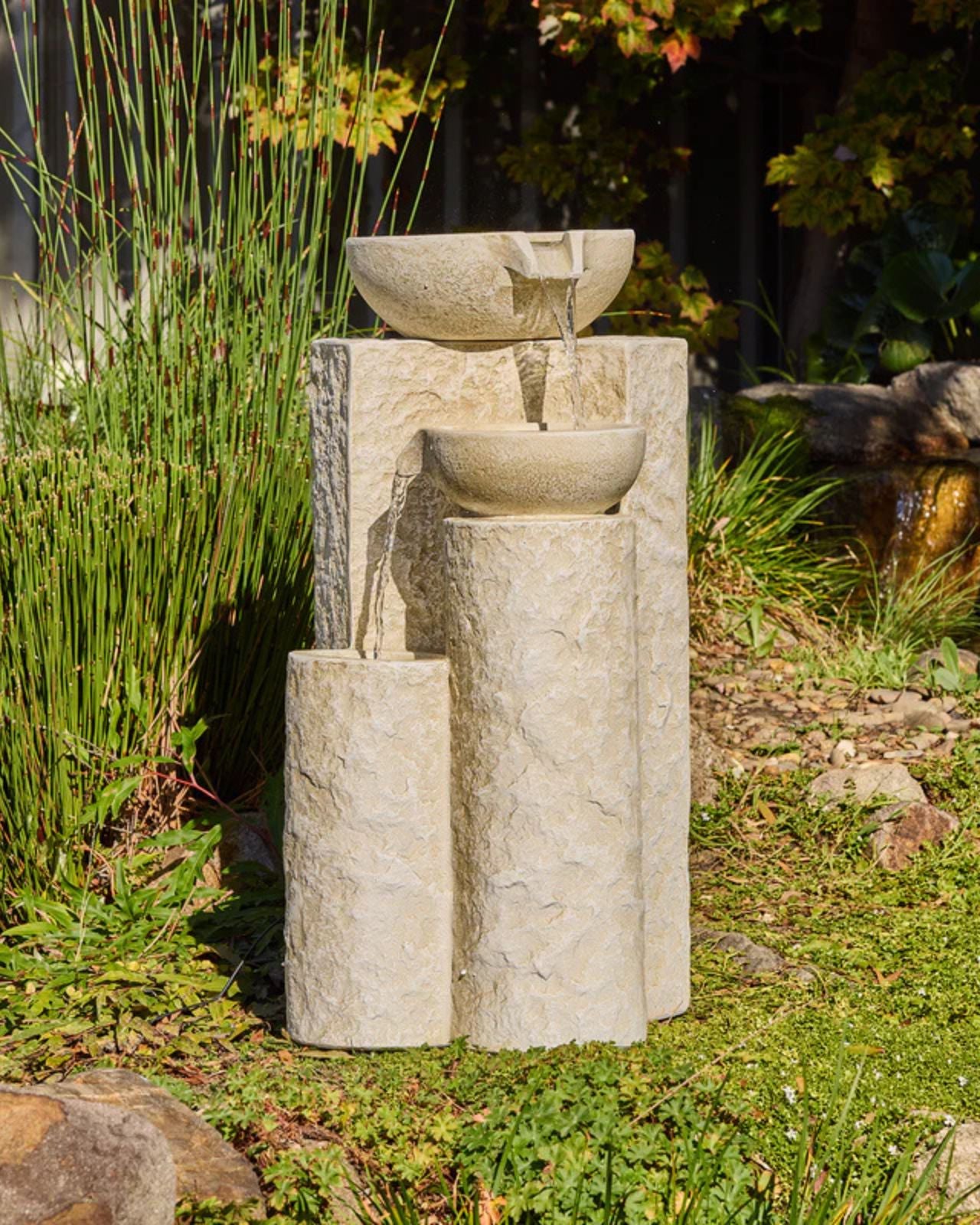 Echo Falls Stone garden fountain with three bowls in a natural setting