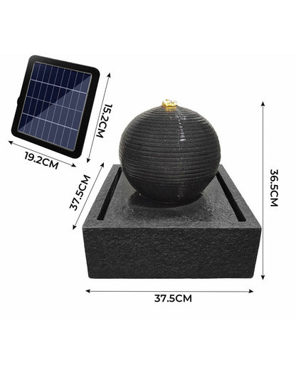 Black spherical water fountain with solar panel and measurements on a white background