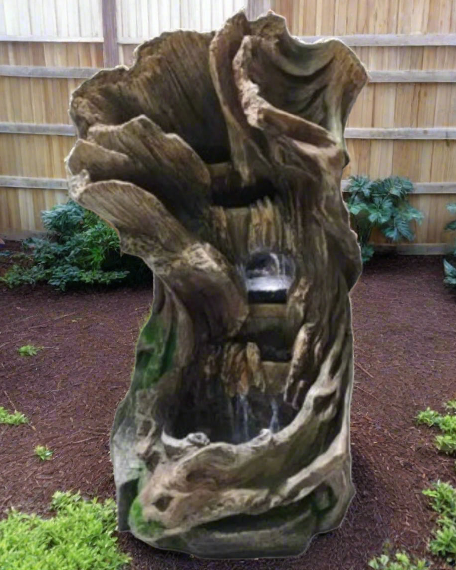 Decorative fountain with natural rock design on a white background