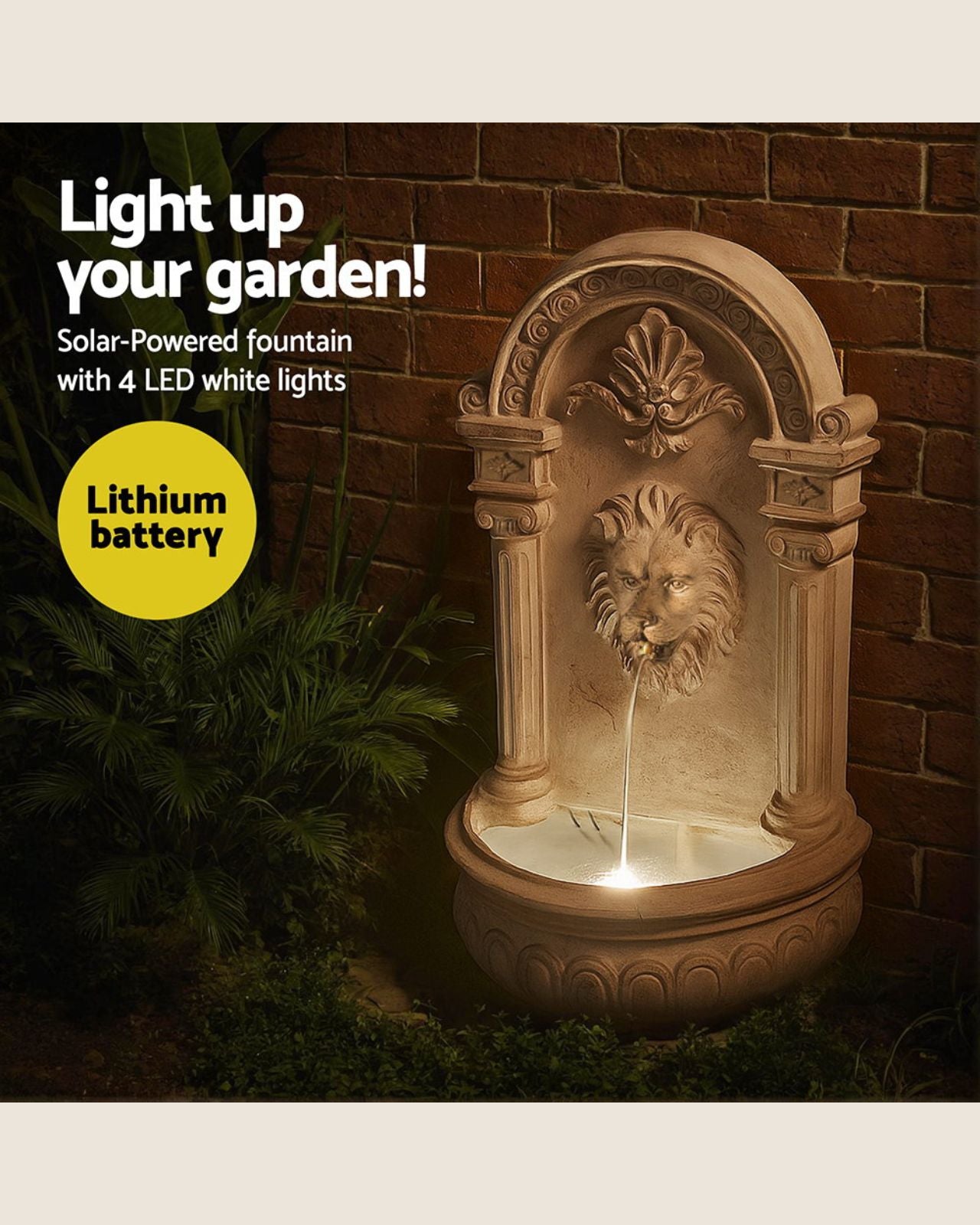Decorative lion head water fountain with solar and LED lights against a brick wall.