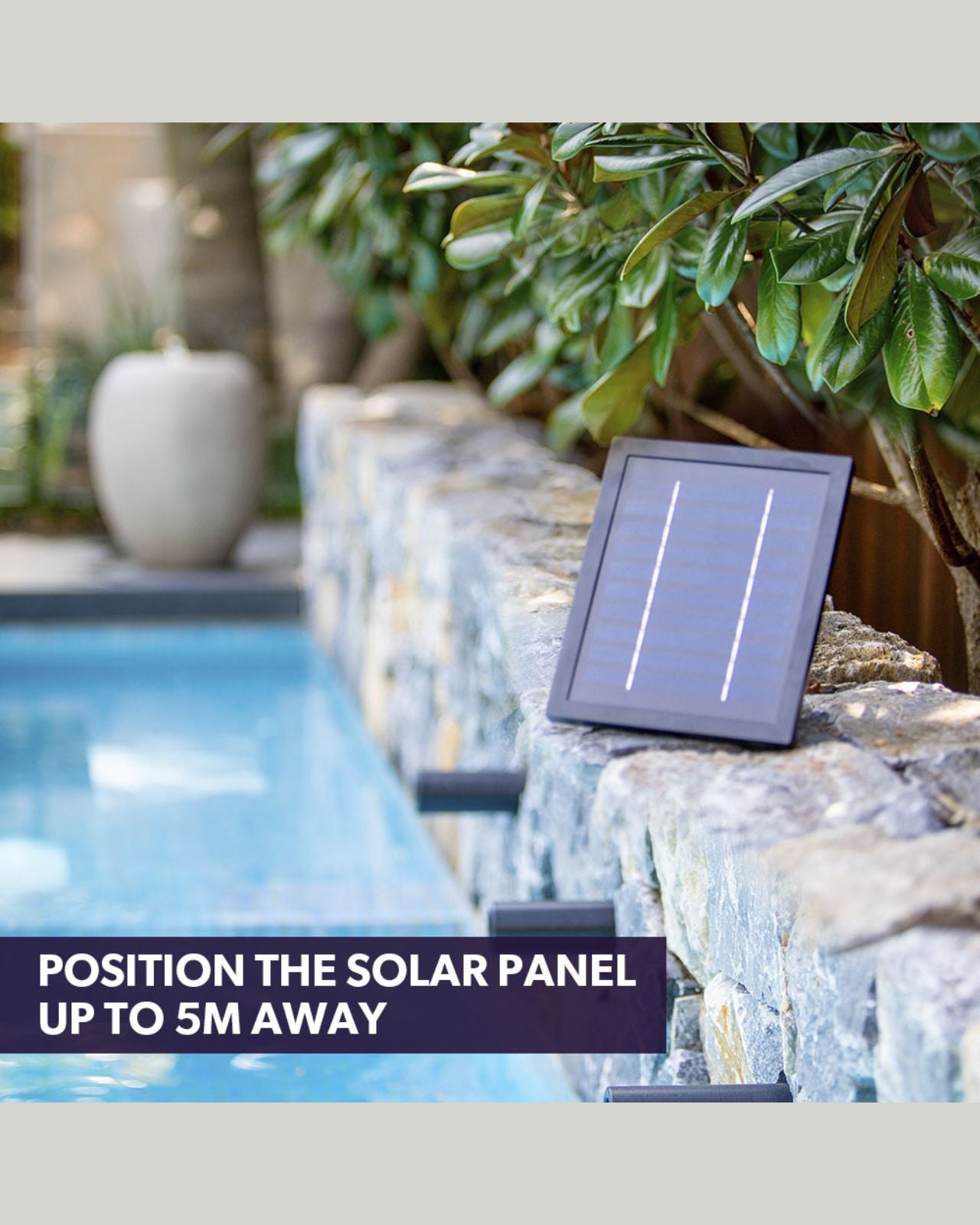 Solar panel on a stone ledge near a water feature with text indicating distance.