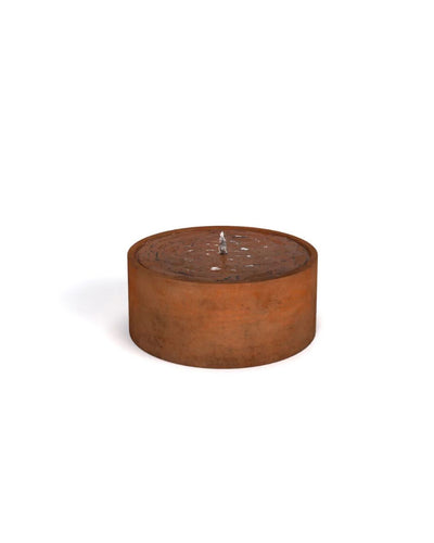 Rust-colored cylindrical corten steel water feature on a white background