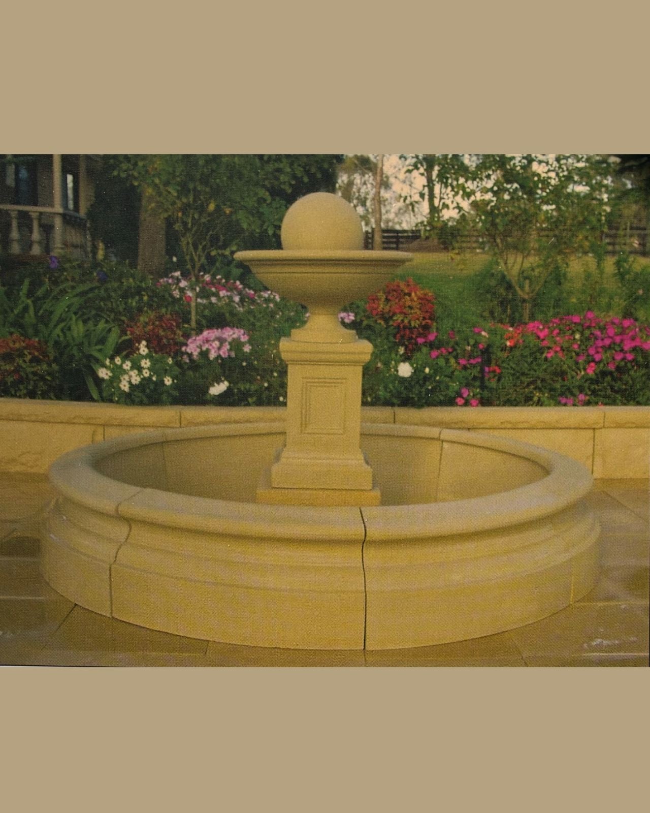 Concrete Stone fountain in a garden setting with circular pond