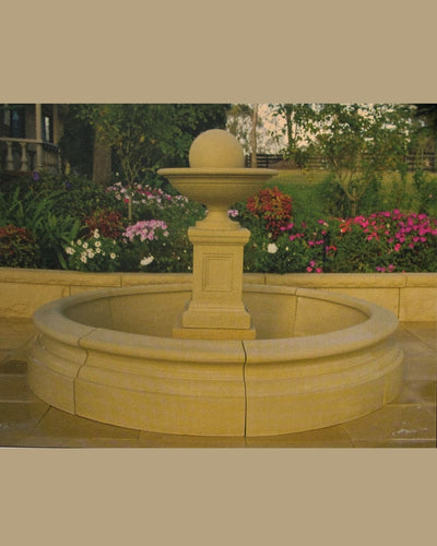 Concrete Stone fountain in a garden setting with circular pond