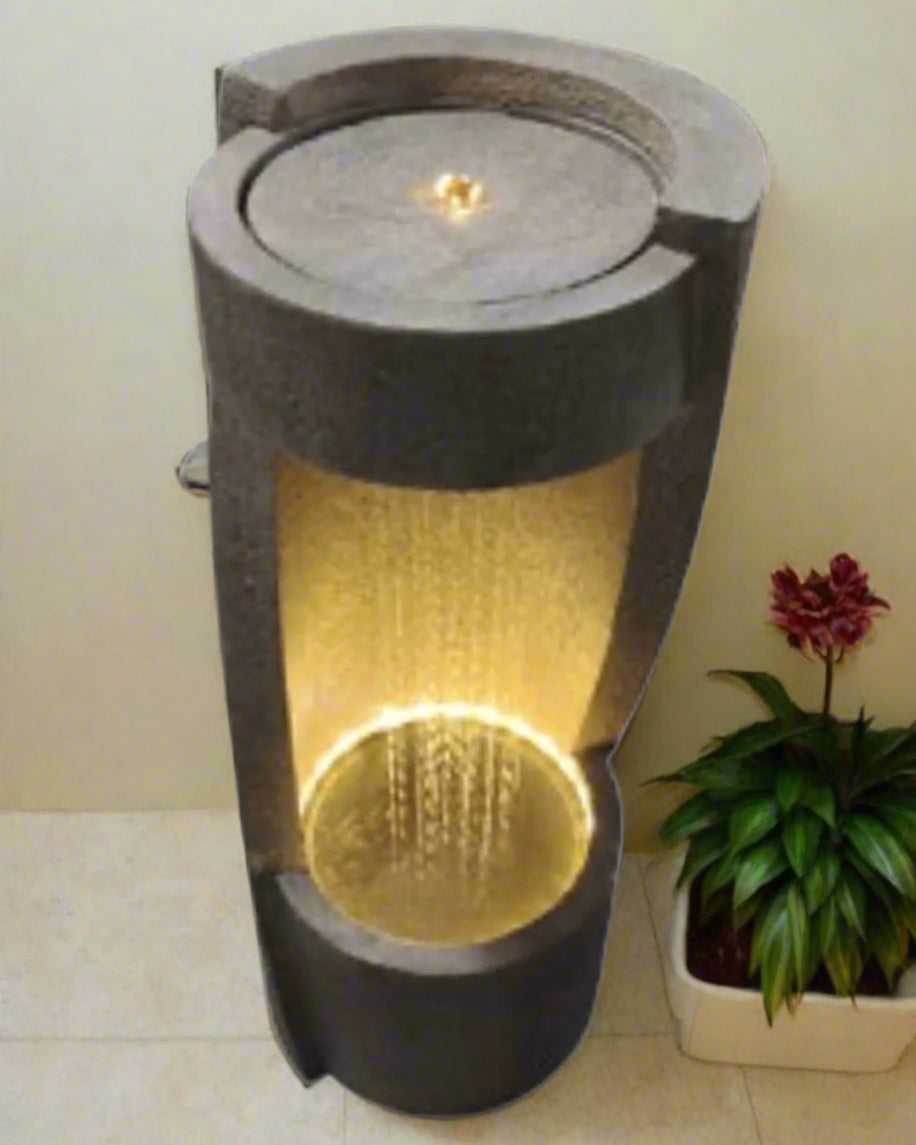 Decorative outdoor light water fountain with a candle-like design on a white background