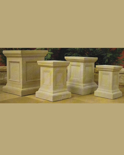 Set of concrete pedestals for water features and fountains on a neutral background