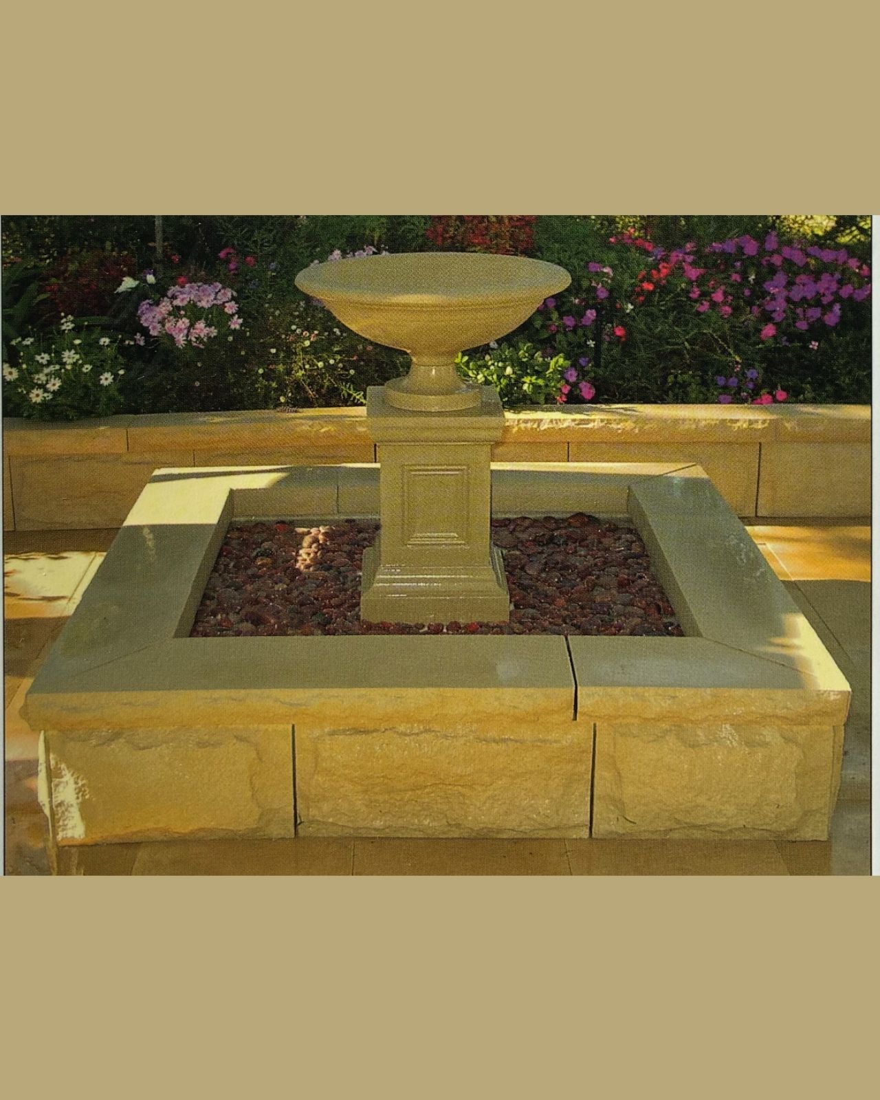 Concrete Stone water fountain with square pond in a garden setting
