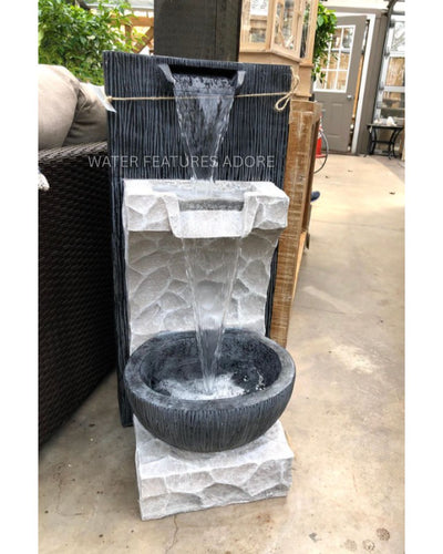 Modern Rustic Rock Texture Tiered LED Wall Water Feature in a backyard