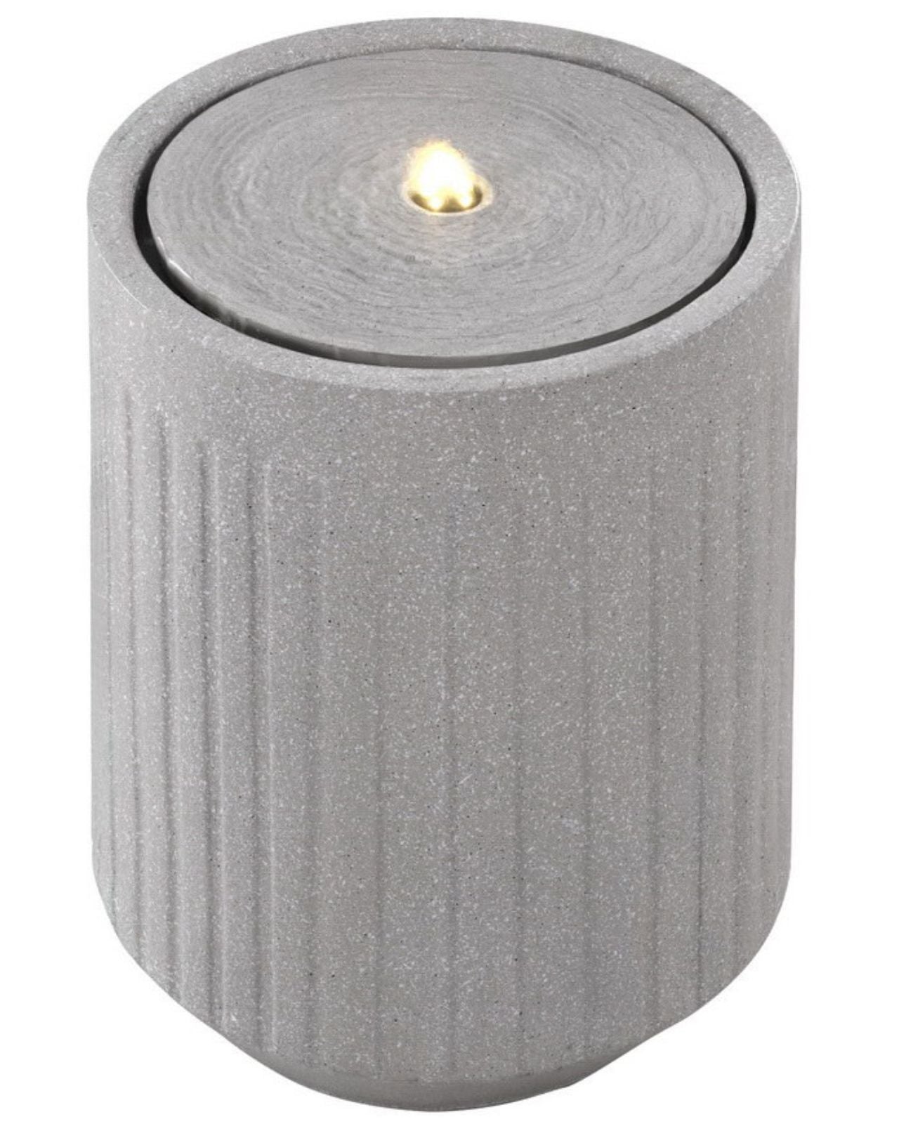 Gray textured candle water feature with a small flame on a white background