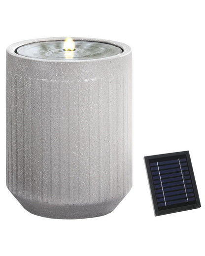 Solar-powered outdoor water fountain with a solar panel 
