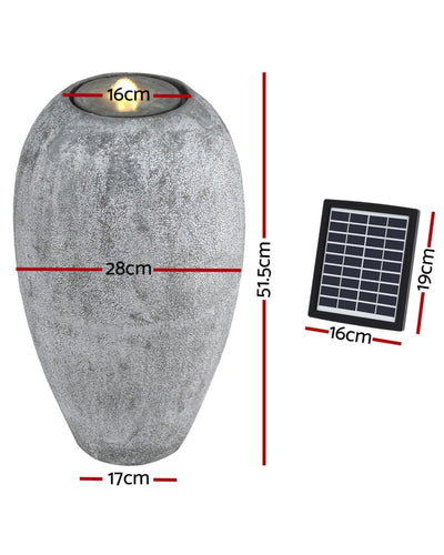 Gray stone-like decorative water feature with solar panel and measurements on a white background