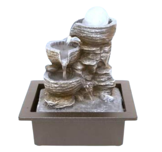 A small decorative rock waterfall tabletop fountain with tiered stone-like tiers, flowing water, a frosted globe light at the top, and a square dark tray base. 