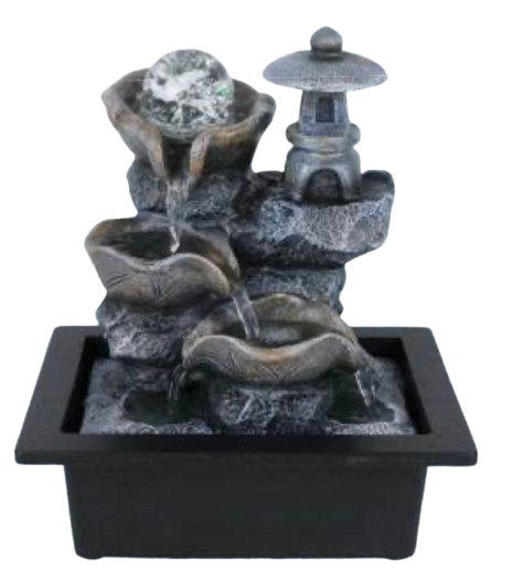 A small decorative tabletop fountain with layered rock-like tiers, flowing water, a clear crystal sphere, and a gray pagoda-style lantern, set in a rectangular black basin.
