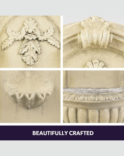 Decorative stone basin water feature with intricate carvings on a light gray background