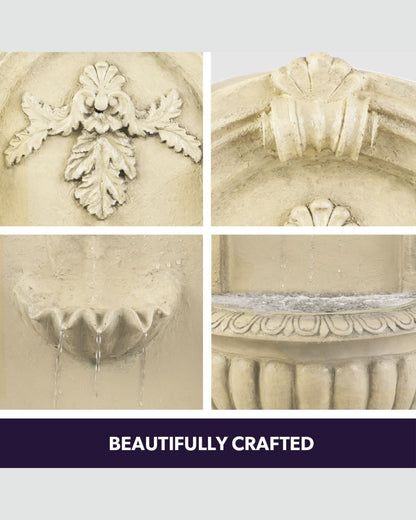 Decorative stone basin water feature with intricate carvings on a light gray background